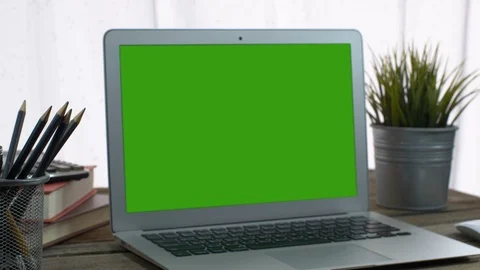 4K : A laptop computer with a key green screen set on work office table. Stock Footage 106047825