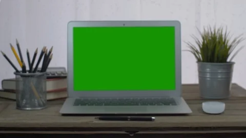 4K : A laptop computer with a key green screen set on work office table. Stock Footage 106048453