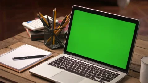 4K : A laptop computer with a key green screen set on work office table. Stock Footage 139849437