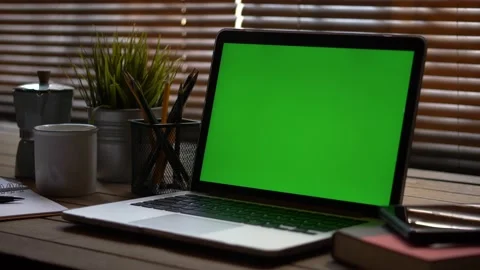 4K : A laptop computer with a key green screen set on work office table. Stock Footage 139873412