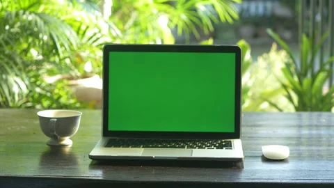 4K : A laptop computer with a key green screen set on work office table. Stock Footage 141346655