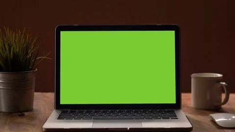 4K : A laptop computer with a key green screen set on work office table. Stock Footage 141349820