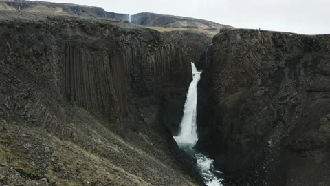 4K Large Waterfall with Vertical Basalt Columns Stock Footage 145721153