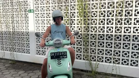 4k learning how to drive scooter Stock Footage 223374380