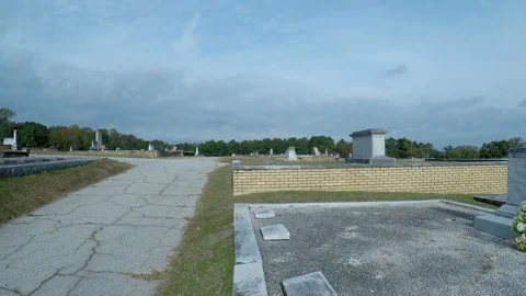 4k-Left To Right Pan-Road To HeadStone Stock Footage 98471609
