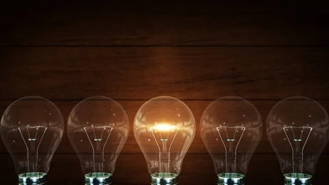 4K Light bulb. Wood background. Vintage. Creative concept Idea innovation and Stock Footage 112607942