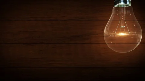 4K Light bulb. Wood background. Vintage. Idea innovation and solution. Creati Stock Footage 112608223