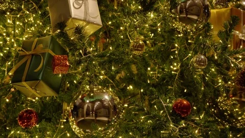 4K: Light decorations during Happy New Year at night. There are gift boxes, ball Stock Footage 120711002