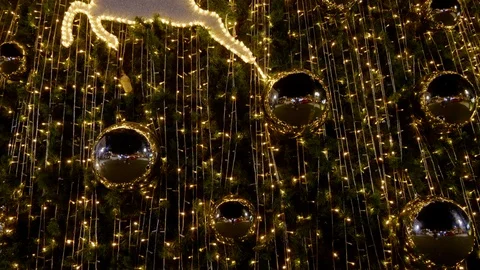 4K: Light decorations during the New Year's Eve festival. There are deer dolls Stock Footage 120710997