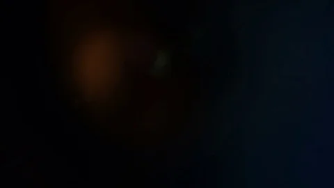 4K Light passes a camera aperture dilating as it resembles a beating heart Stock Footage 69786638