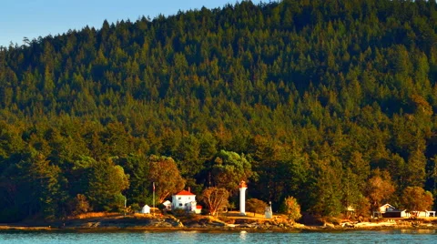 4K Lighthouse and House on Ocean Island, Sea and Island Landscape, Dusk Sunset Stock Footage 66690059