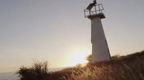 4K: Lighthouse on Cliff Bluff Panning up @ Sunset Stock Footage 67514578