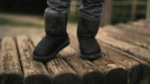 4k Little feet bouncing at playground Stock Footage 44332406