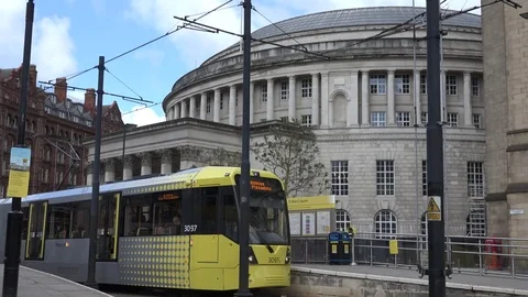 4K Local tramway arrive in station Manchester public tram people transportation Stock Footage 76721635