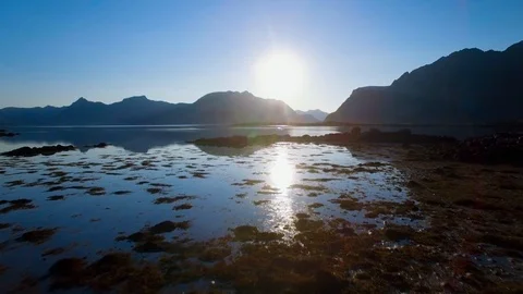 4K Lofoten - Mirror reflection of setting sun, sea and mountains Stock Footage 93888624