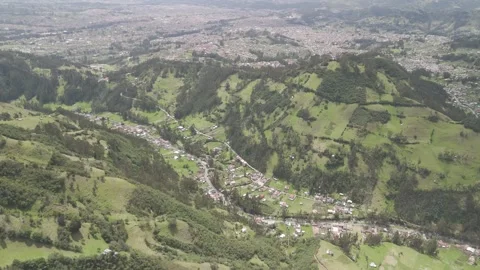 4K Log Drone Apporaching Valley with Road and Houses Cuenca Ecuador Stock Footage 271372606