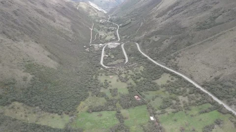 4K Log Drone Approaching Motorway in Green Valley Cuenca Ecuador Stock Footage 277211149
