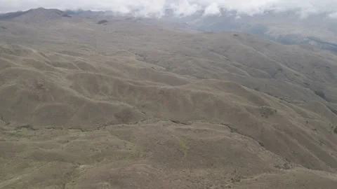 4K Log Drone Flying Over Ridge Revealing Brown Mountain Landscape Cuenca Ecuador Stock Footage 274865039