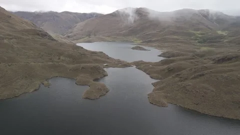 4K Log Drone Flying over Mountain Lakes and Revealing Mountains Ecuador Stock Footage 277210815