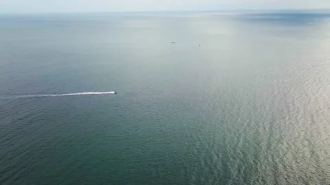 4K Long-distance Drone View of a Jetboat Ride at Sea Stock Footage 143863281