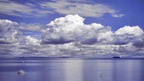 4k long exposure infrared timelapse of sea with ships and changing summer clouds Stock Footage