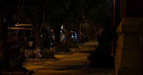 4K LONG SHOT OF EMPTY CITY SIDEWALK AT NIGHT Video stock 131107830