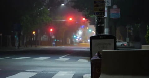 4K LONG SHOT OF EMPTY, HAZY STREET AT NIGHT Stock Footage 131124343