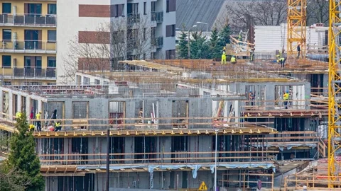 4k long timelapse footage of teamwork at construction site. Modern condo Stock Footage 156024546