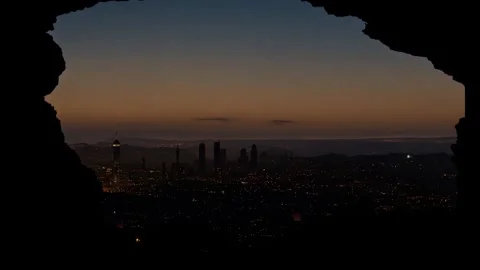 4K Looking from inside a cave out towards city   Timelapse Stock Footage 284284237