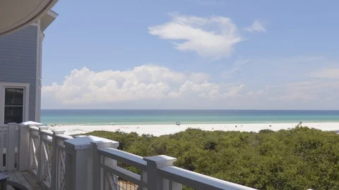 4K Looking Out Over the Beach and Emerald Green Ocean Water From Patio Stock-Footage 123087031