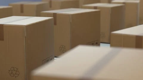 4K Loop Cardboard boxes on conveyor belt line isolated on white grey background. Video stock 131449530