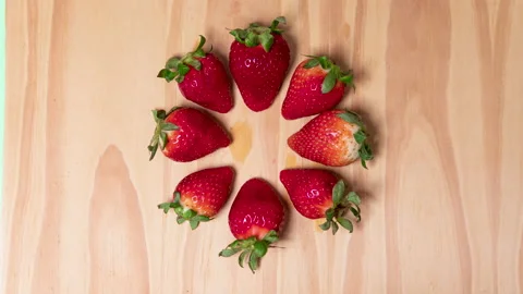 4K loop stop motion video of strawberries appearing and disappearing in a Stock Footage 130793529