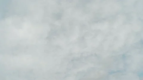 4K Loop of white clouds over blue sky time lapse Stock Footage 133500863