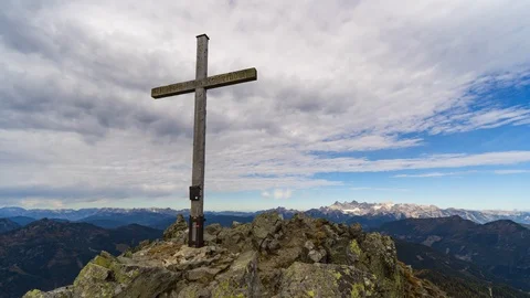 4k looping time lapse clouds pass over mountain summit cross Stock-Footage 118199258