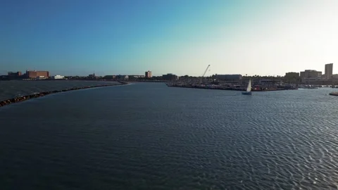 4K Low-Aerial Tracking Shot of Sailboat on Corpus Christi Bay at Sunset Stock Footage 337995220