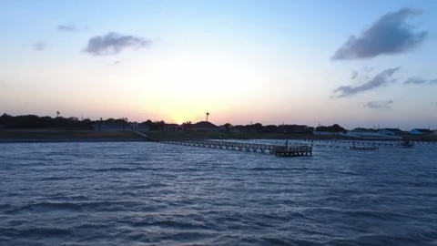 4K Low-Angle Aerial View of Loyola Beach Pier at Sunset Stock Footage 310953769