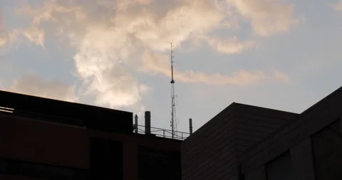 4K LOW ANGLE OF CLOUDY SKY BEHIND RADIO TOWER Video stock 132601254