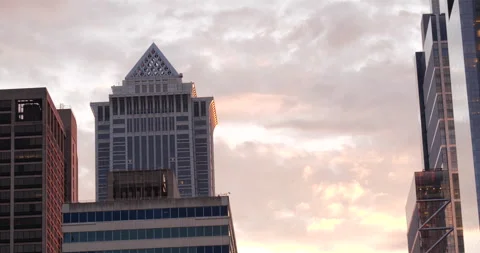 4K LOW ANGLE SHOT OF CITY BUILDINGS AND DUSK SKY Stock Footage 131461668