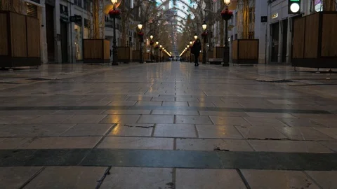 4k low angle static shot of a pedestrian commercial avenue with decorations Stock Footage 123530561