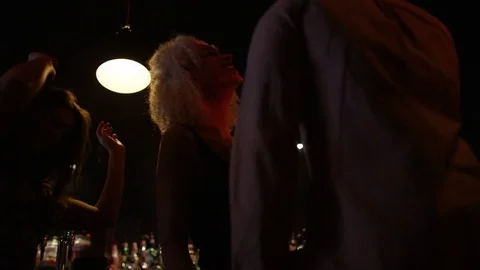 4K Low Angle View Of Young Party Crowd Dancing &amp; Having Fun In Nightclub Stock Footage 75654220