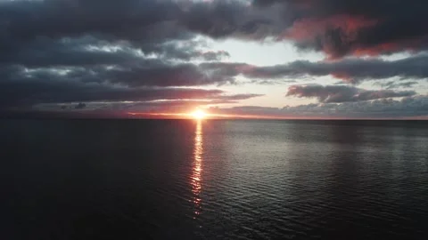 4K low drone flight over the sea during sunrise along the Welsh coast Видео 296803831