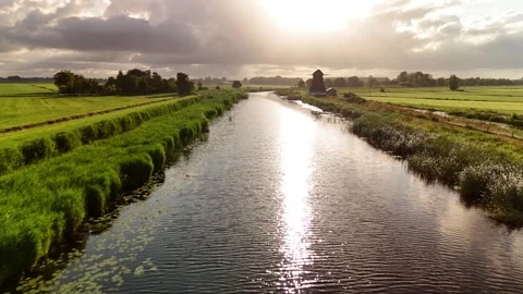 4K Low Drone Flight Over Canal Water in Netherlands Summer Clear Sky Видео 317401737