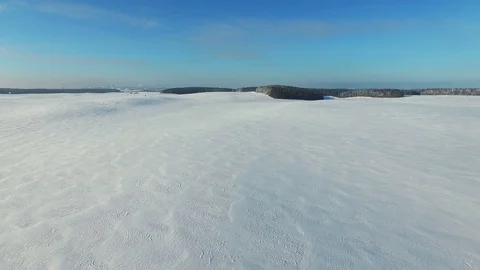 4K. Low flight above snow fields in winter, aerial panoramic view (Snow Desert) 動画素材 81721374