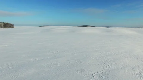 4K. Low flight and takeoff above snow fields, aerial view (Snow desert) 動画素材 59484994