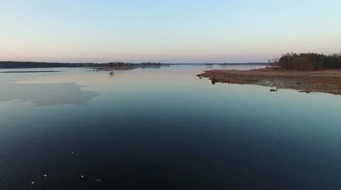 4K. Low flight and takeoff over wild lake with ducks on sunset, aerial. 動画素材 61738811