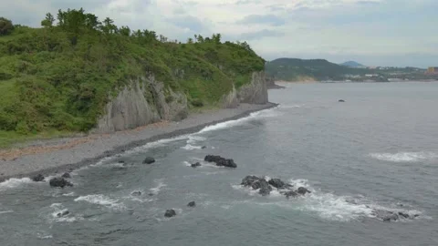 4K Low Flight Drone View of Gaetkkak Columnar Jointing,  Jeju Island. Stock Footage 143863054