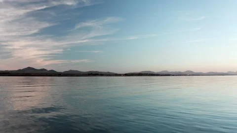4K low flight at sunset towards Snowdonia mountains along the Welsh coast 스톡 동영상 250563947