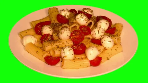 4k – Macaroni tubes with mozzarella, cherry tomatoes and spices on plate Stock Footage 56784387