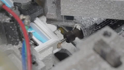 4K. machine for cutting and cleaning welds and milling on PVC plastic window. Stock Footage 134212732
