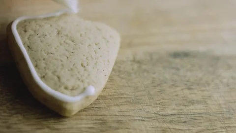 4K Macro Clean White Icing on a Santa Cookie Stock Footage 342113659